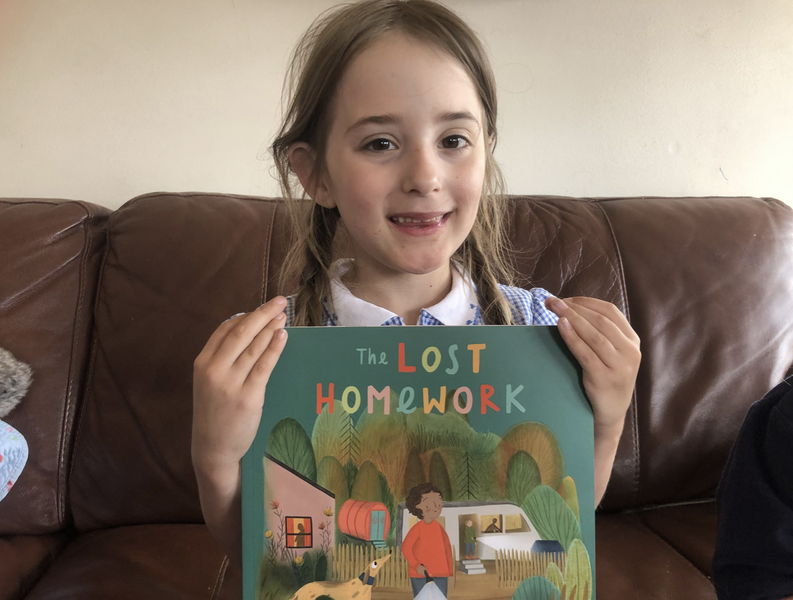 Isabelle Smith holding a copy of the lost homework by Richard O'Neill 
