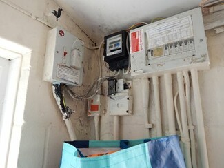 Damp and dodgy electrics in a day room at Oak Tree Field Traveller site. You don't have to be a rocket scientist to know that water and electrics don't mix