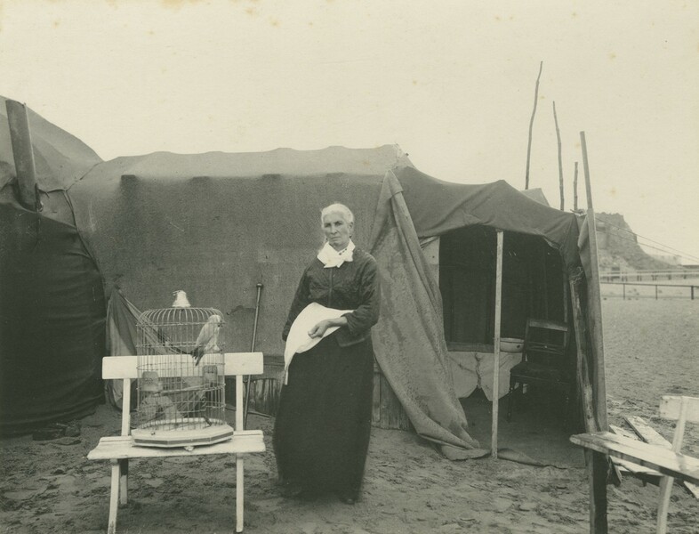 Lementeni Smith and her fortune telling African Grey Parrott, on South Shore beach, Blackpool.