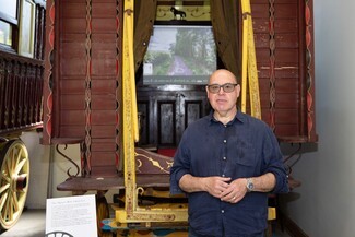 artist Dan Turner outside a vardo