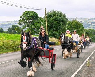 Sarah Lowther leading the drive with her horse Violet as is the tradition