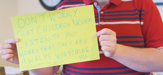 A piece of card with writing on saying Dont worry children never listen to you worry that they are always watching. 