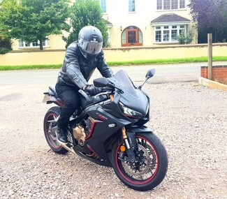 “We must have shades!” Keith on his Honda CRB.