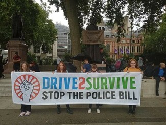 Antonia, Scarlett, Maisie and Ruby fly the Drive2Survive banner at the London Kill the Bill Rally last weekend © Catherine Gould