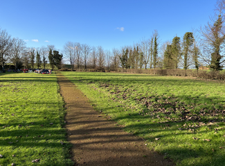 "The cemetery is really quite small for our population” say Milton Parish Council. The empty traditional and grassed area burial ground at Milton Cemetery taken from the entrance to the field. The traditional burial ground is on the left and the grassed burial ground is on the right. The few graves in the traditional burial ground, including the Traveller graves, can just about be seen in the distance.