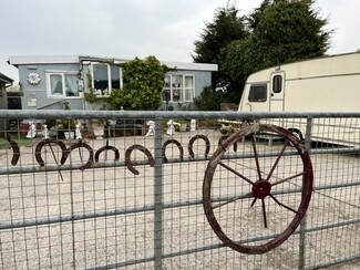 “A red dust, thought to be from the steelworks, sticks to the caravans and cars” – Rover Way, Cardiff