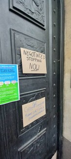 Placards on the door of the Guildhall. Credit GRT Solidarity Network