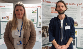 Candice Fawsett (left): A white young woman stands in front of a display about traditional Gypsy caravans. She has long blonde hair and grey eyes. She is wearing a brown cardigan, a white roll neck jumper and a blue lanyard with her ID attached. Christian Johnson (right): A white young man stands in front of a display about traditional Gypsy caravans. He has chin length brown hair, a short beard and brown eyes. He is wearing a blue shirt, a white T-Shirt, blue trousers and white name tag. He is smiling.