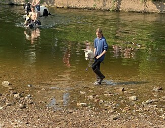 Piper Ann rides her hobby horse into the River Eden at Appleby Fair, 2023 – and a social media post of the photo goes viral! © Brian Graham