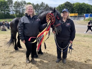 People's Champion and Best at Appleby winner Raven with welfare vets Chloe and Nicola