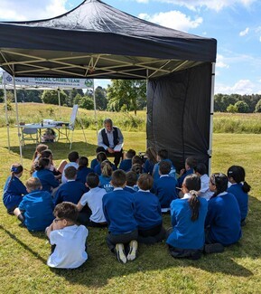 Richard O’Neill reading to Wolvey Year 5 pupils at the final event. Photograph by Gemma Lees