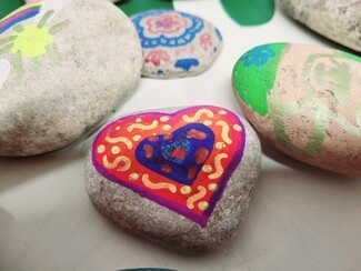 Painted rocks from sessions facilitated by Abeline and Leyla-Grace McShane. Photograph by Martin Rone-Clarke