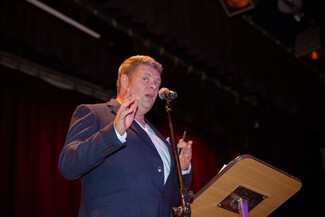 Host Jake Bowers - suited and booted and armed with a few funnies! Photograph by Eszter Halasi