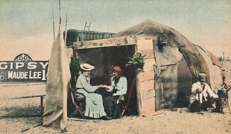 Maude Lee and her husband Bendigo Lee by her fortune-telling booth at South Shore, Blackpool.