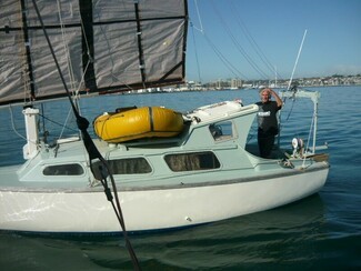 A dream come true - Bob Lovell in New Zealand aboard his sailing boat, which he restored and built himself